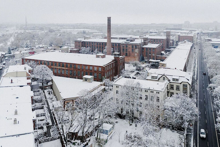 Luftbild der Geländes der ehemaligen Baumwollspinnerei ein Winter